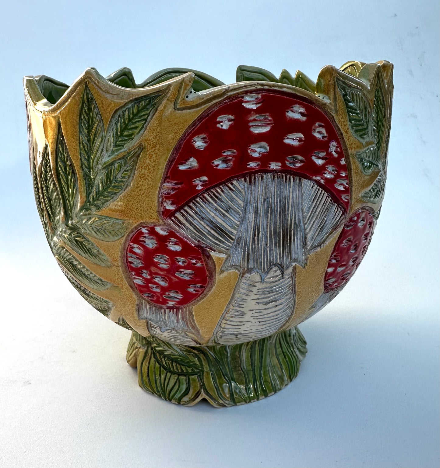 Large bowl with Amanita mushrooms, ferns, and hearts