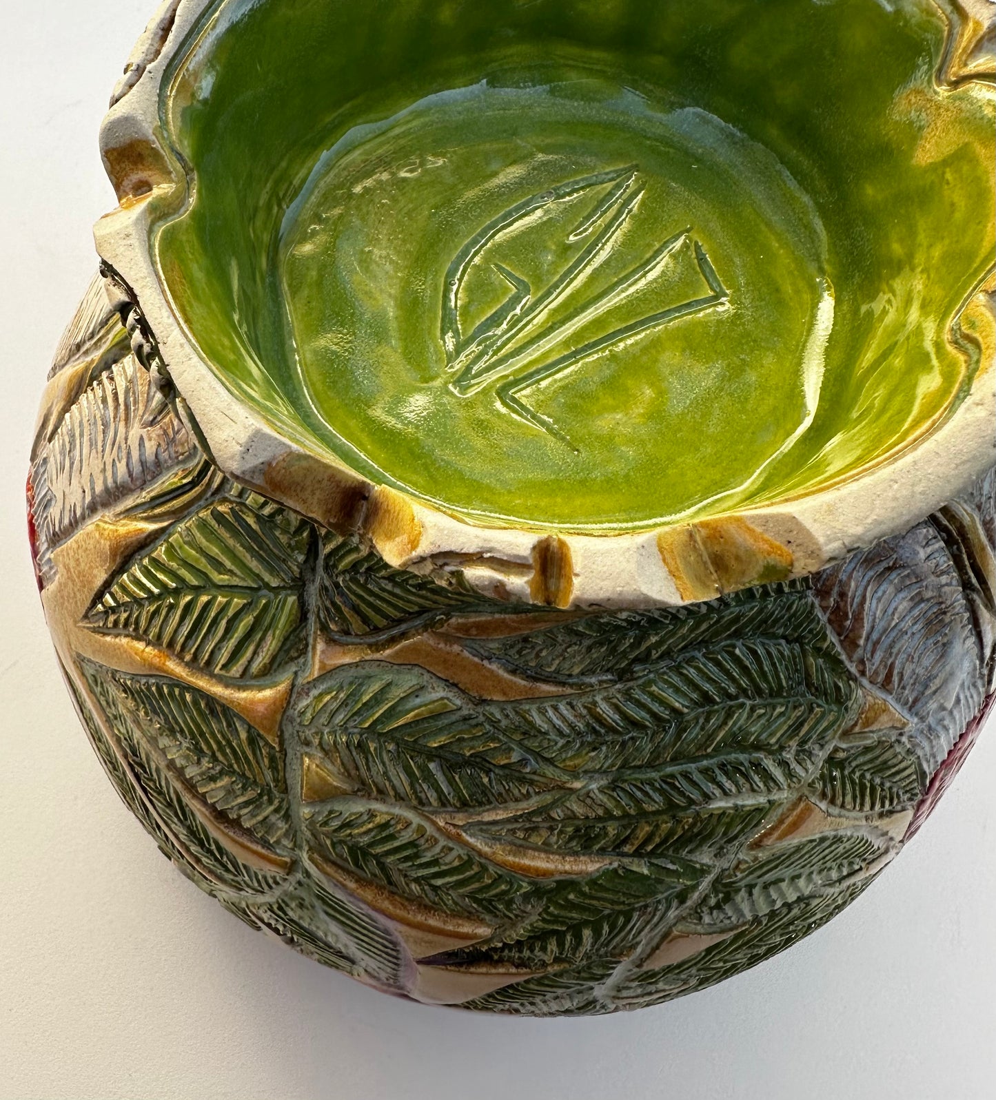 Large bowl with Amanita mushrooms, ferns, and hearts
