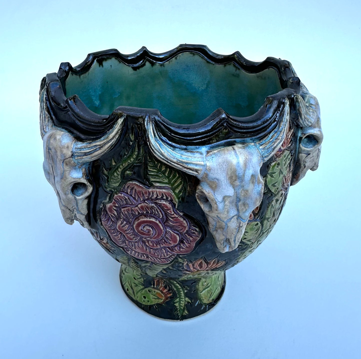 Bowl with steer skulls, roses, and cactuses