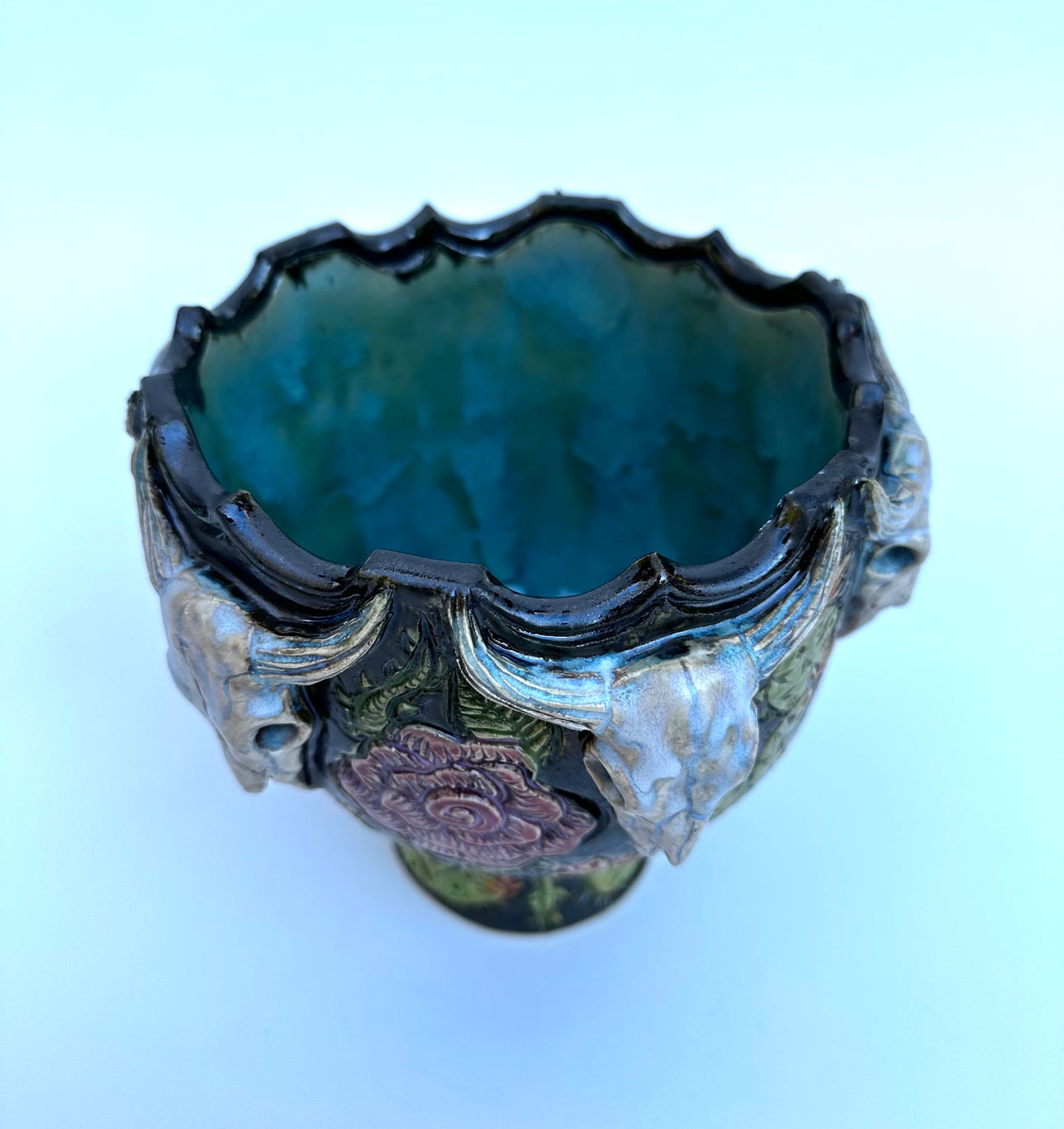 Bowl with steer skulls, roses, and cactuses