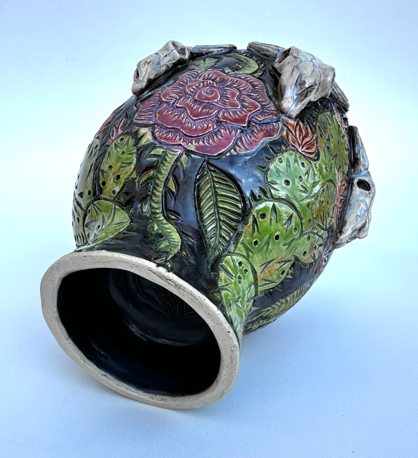 Bowl with steer skulls, roses, and cactuses