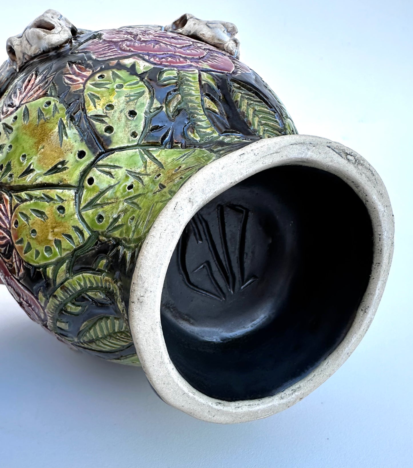 Bowl with steer skulls, roses, and cactuses