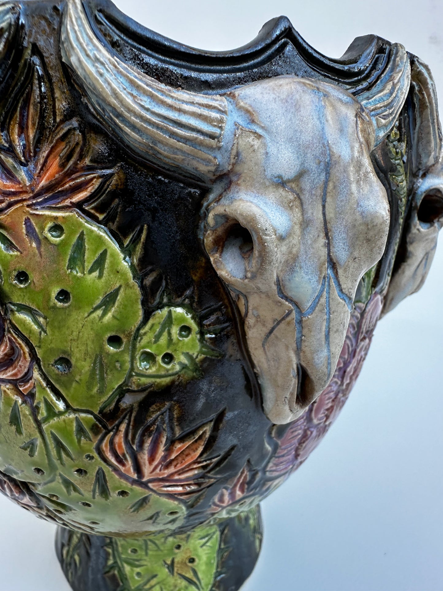 Bowl with steer skulls, roses, and cactuses