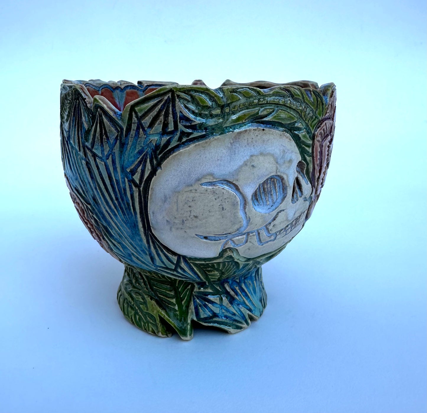 Small bowl with skulls roses, and crystals