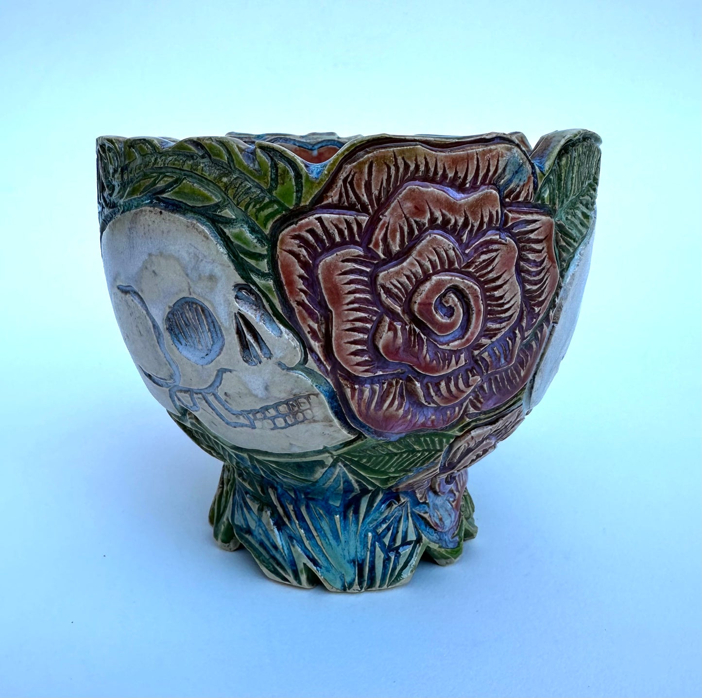 Small bowl with skulls roses, and crystals