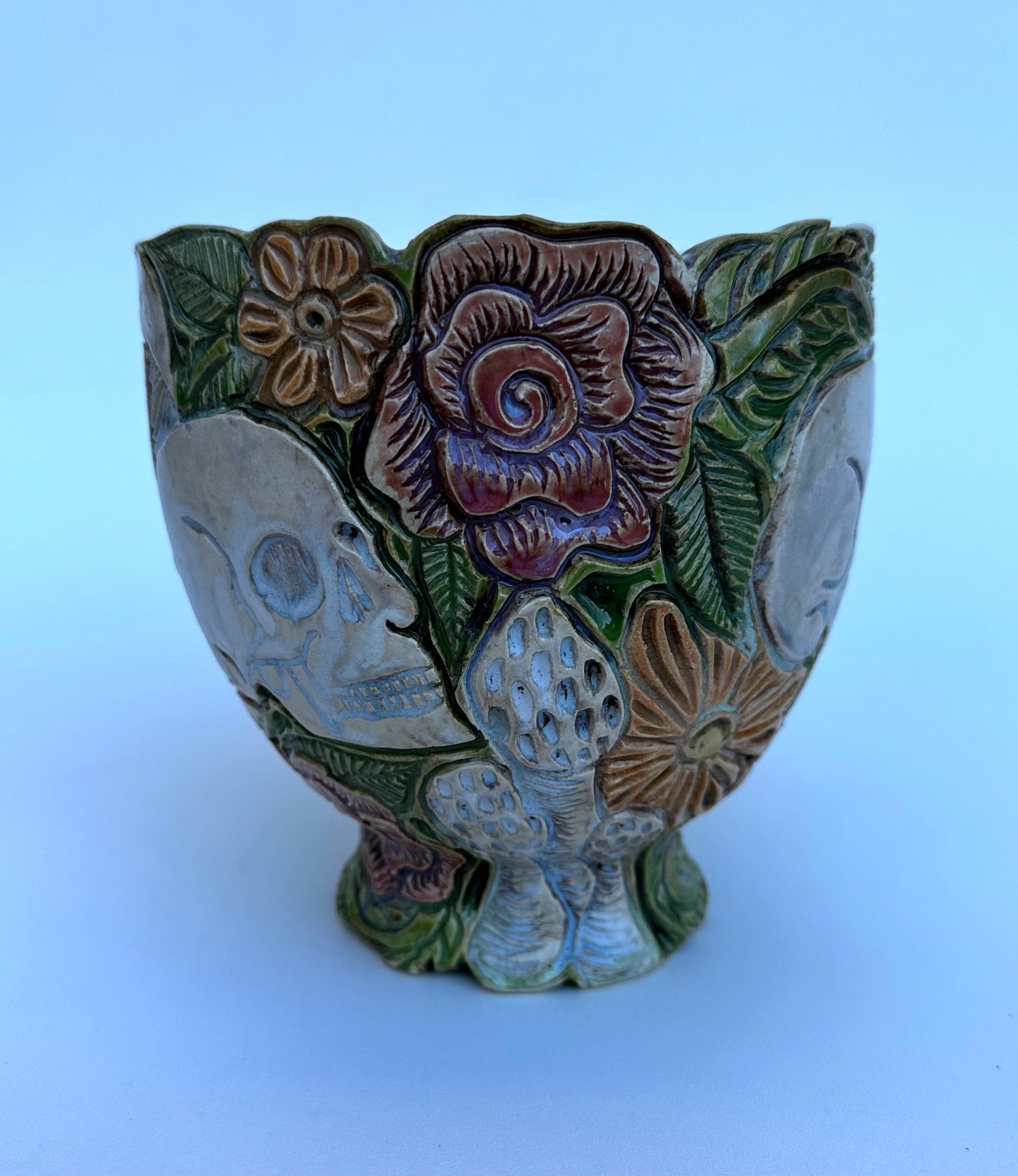 Bowl with skulls roses, daisies, and mushrooms