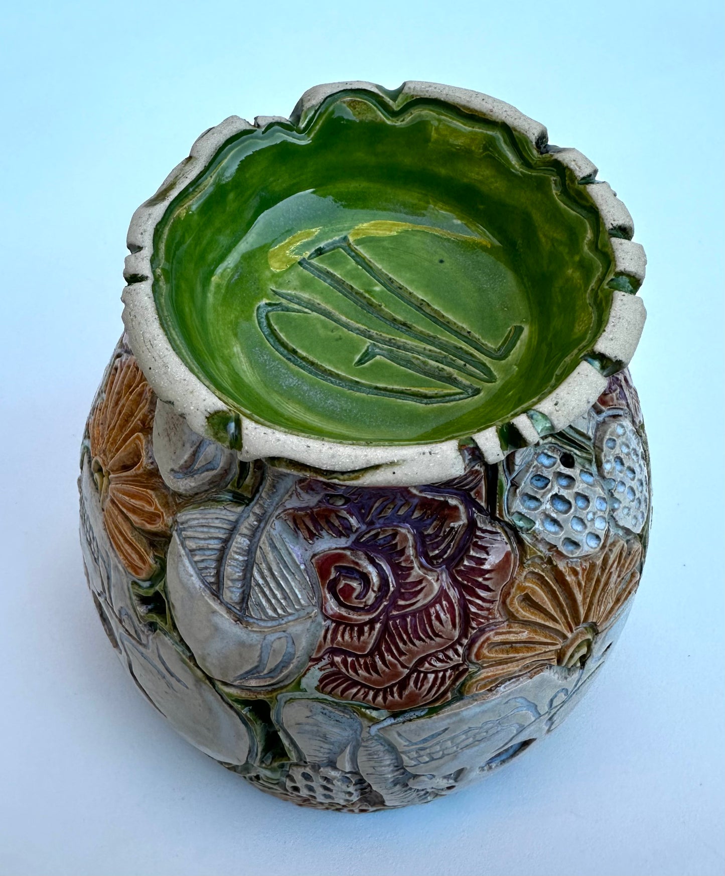 Bowl with skulls roses, daisies, and mushrooms