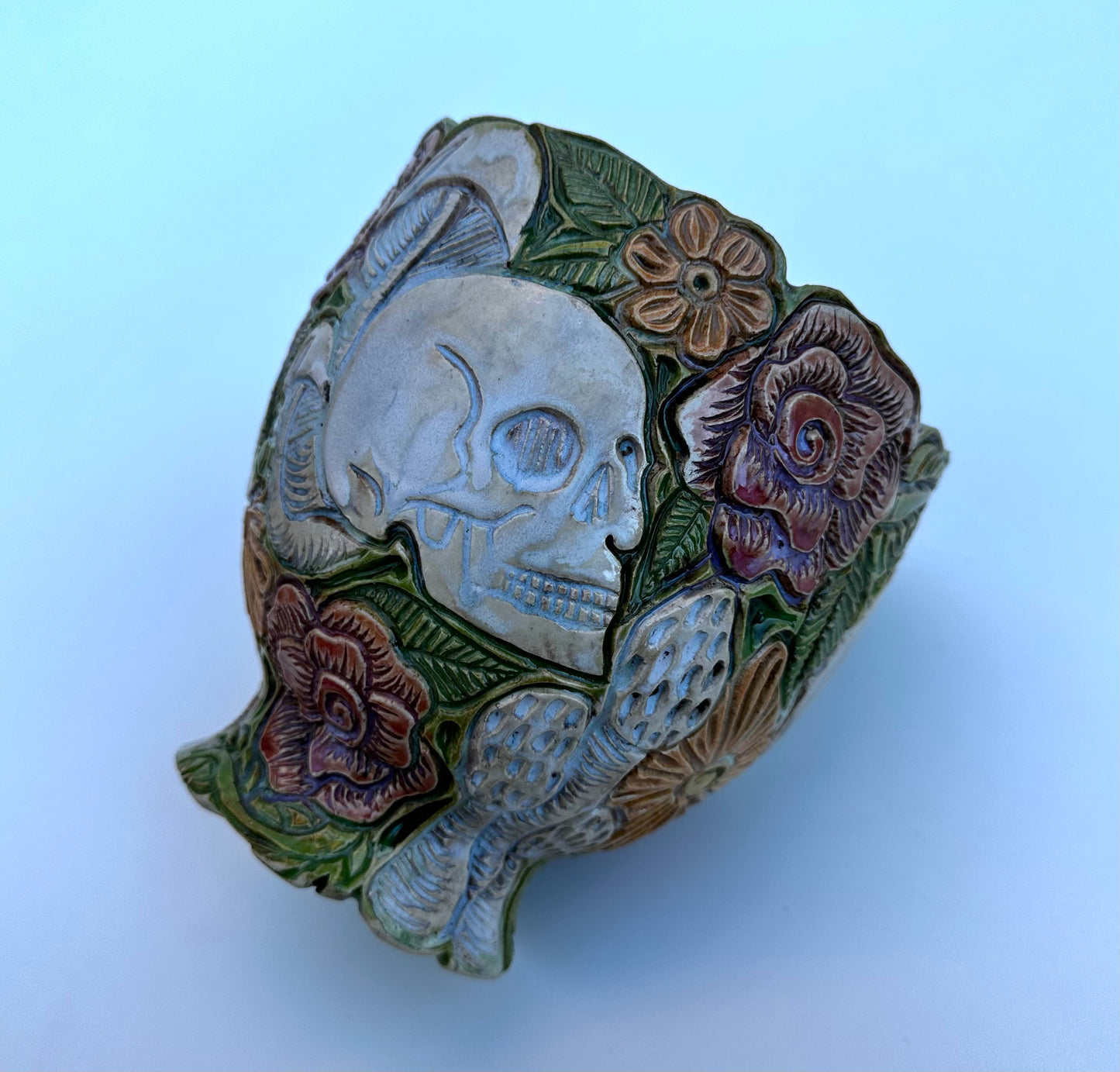 Bowl with skulls roses, daisies, and mushrooms
