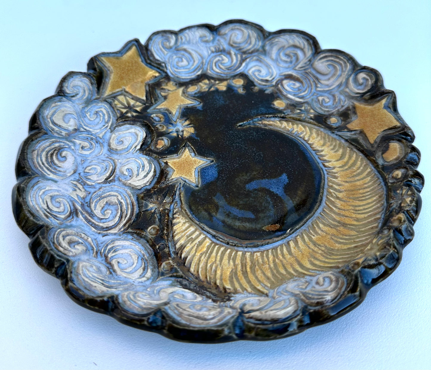 Small plate with moon, clouds, and stars