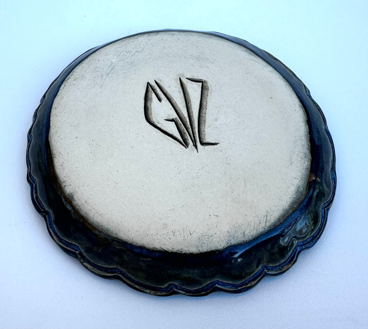 Small plate with moon, clouds, and stars