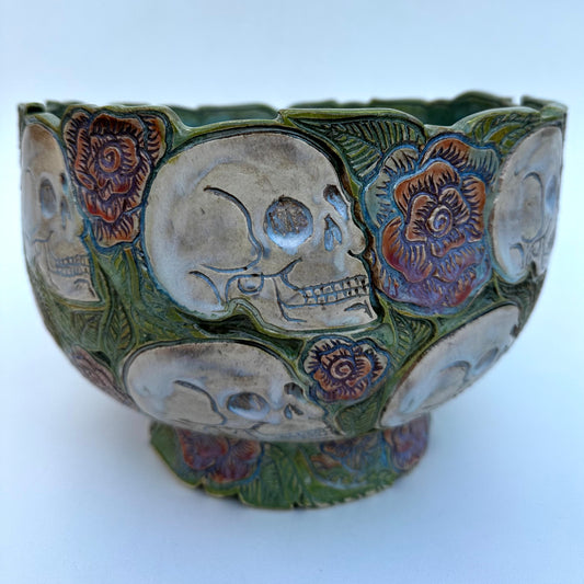 Large hand carved serving bowl with skulls and roses