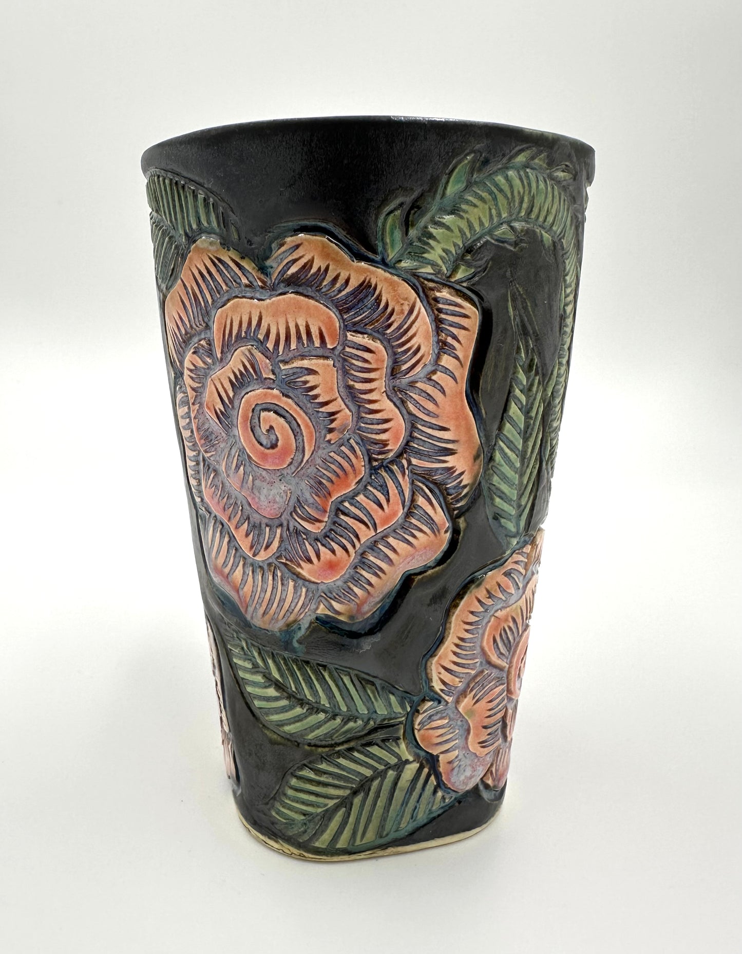 Black mug with carved Roses
