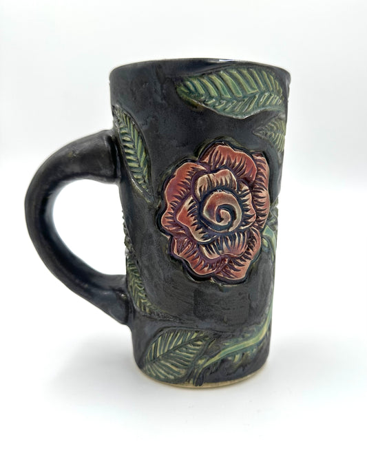 Black mug with carved Roses