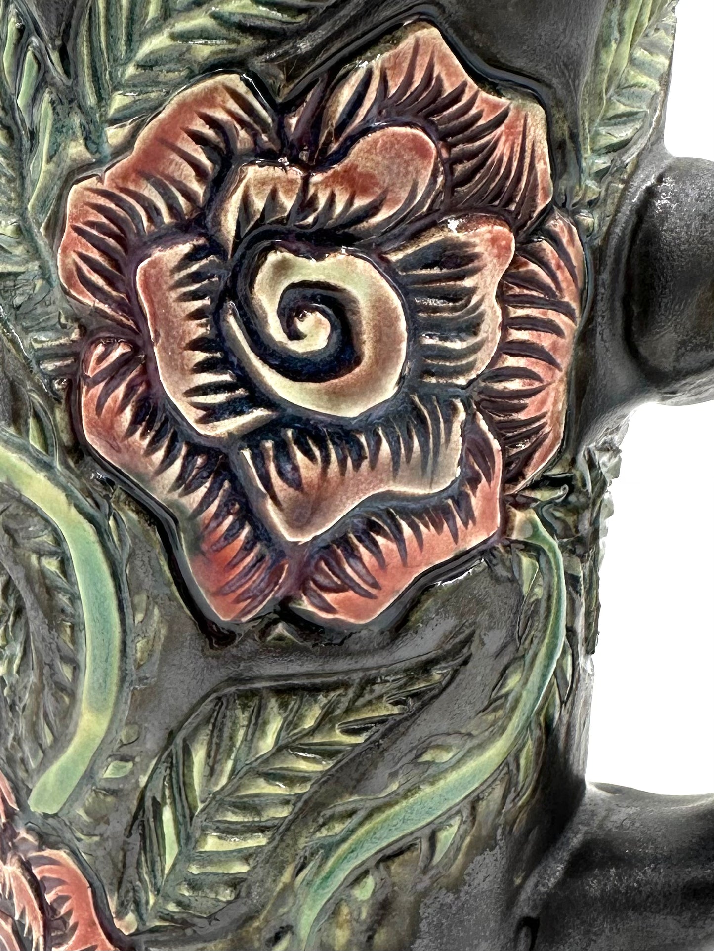 Black mug with carved Roses