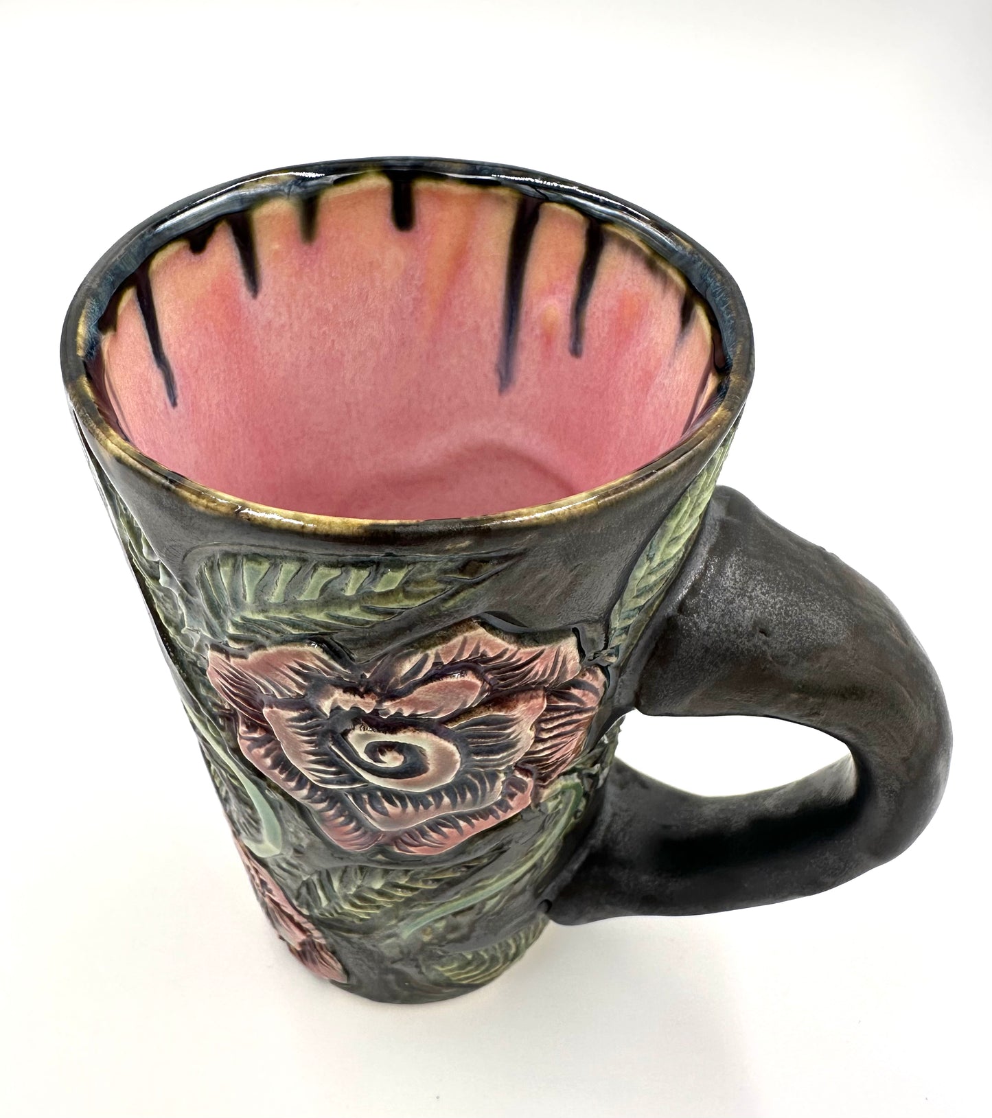 Black mug with carved Roses