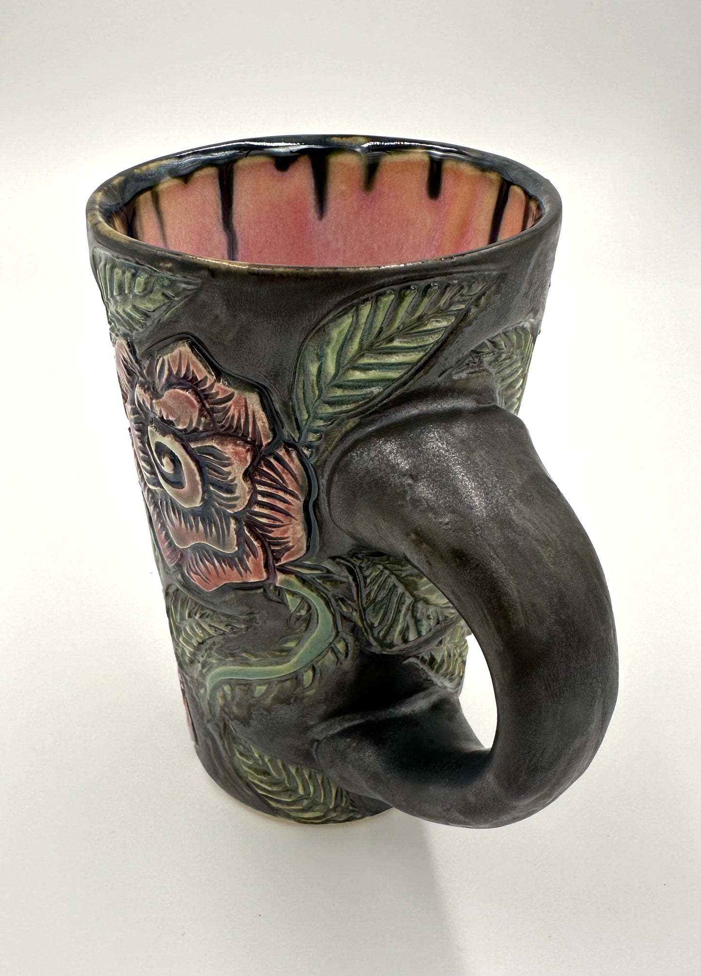 Black mug with carved Roses